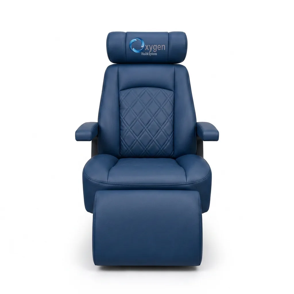 Navy blue diamond-quilted leather reclining chair with Oxygen Health Systems branded headrest, padded armrests, and an extended footrest