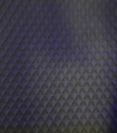 Dark charcoal gray quilted diamond-pattern leather interior lining option for the Elite Comfort 34D hyperbaric chamber